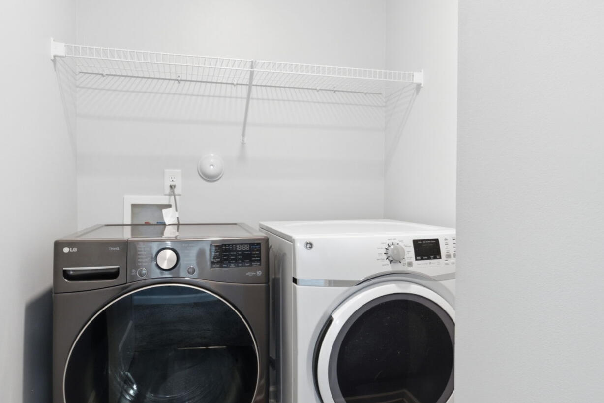 Laundry closet with washer and dryer in the Garner, NC townhouse rental