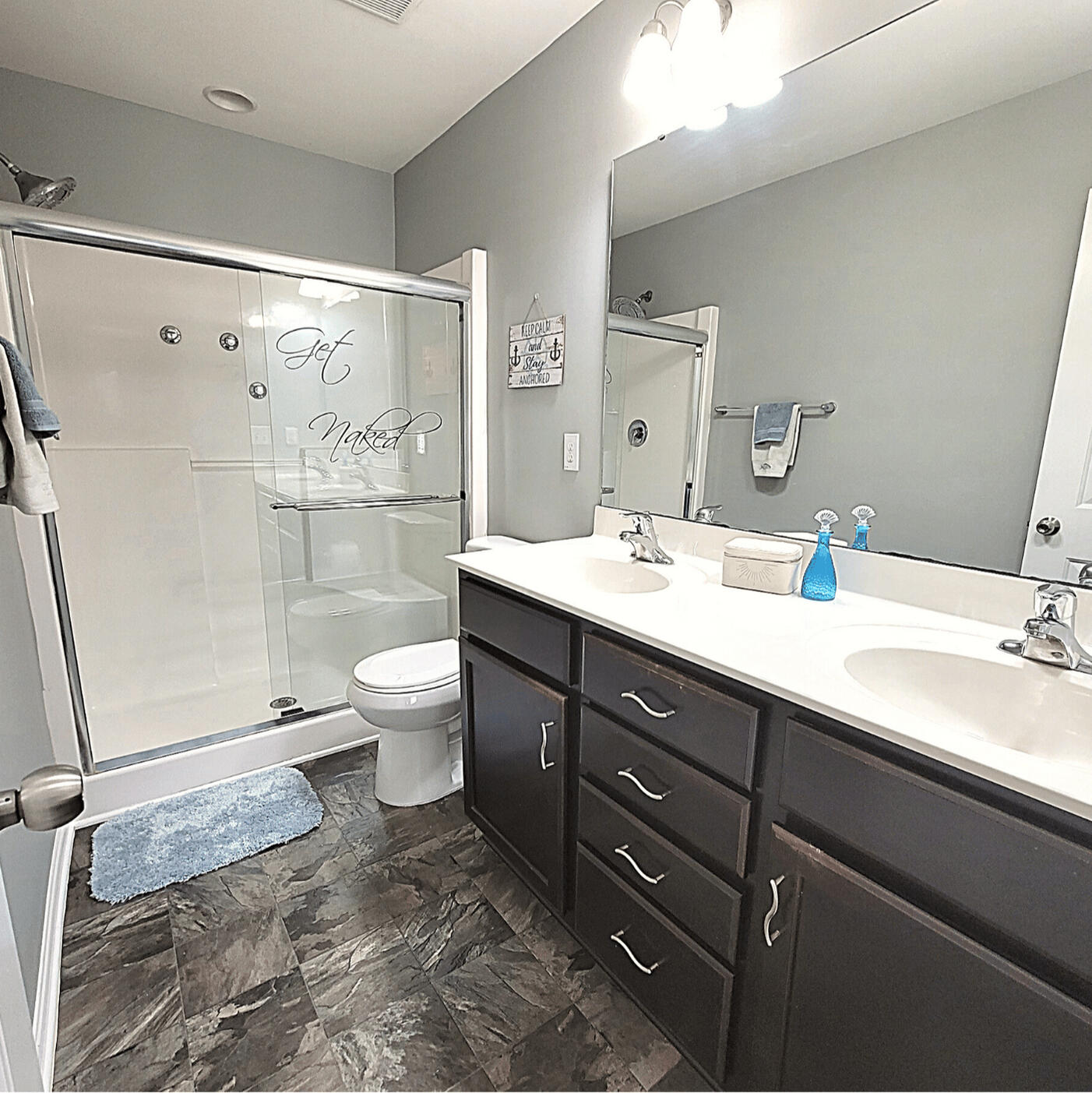 Full bathroom with walk-in shower and vanity in the Wake Forest rental home
